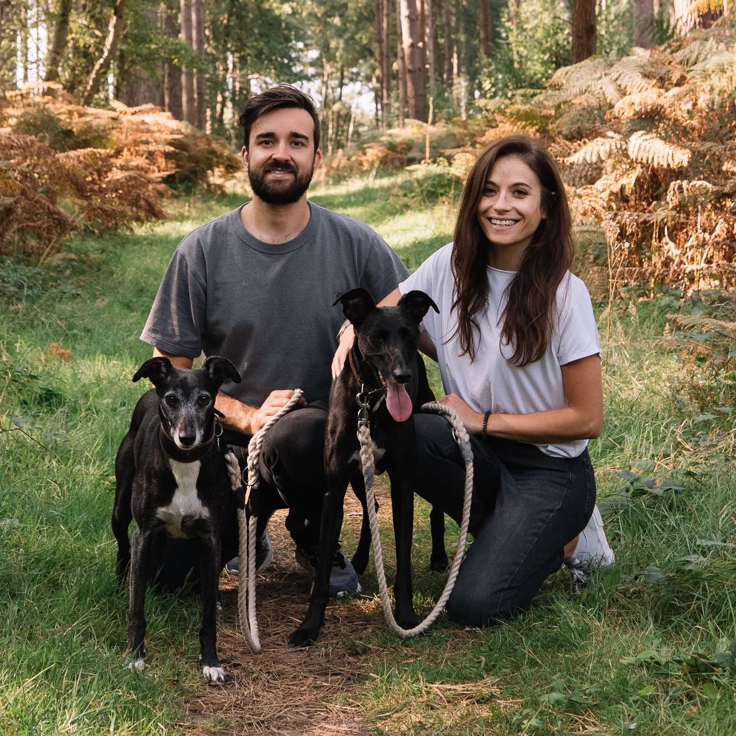 Meet the Smug Mutts Team, Owners and there Two Black Dog Crouch Down